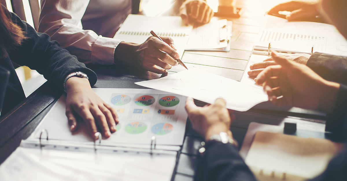 Group of business people writing