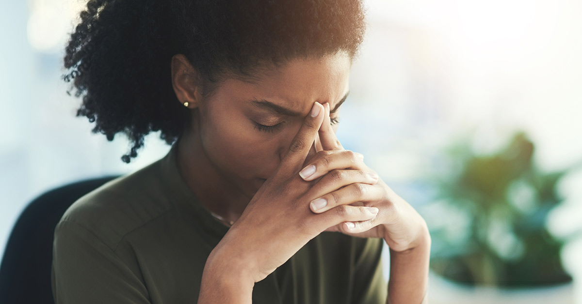 Stressed woman in professional setting