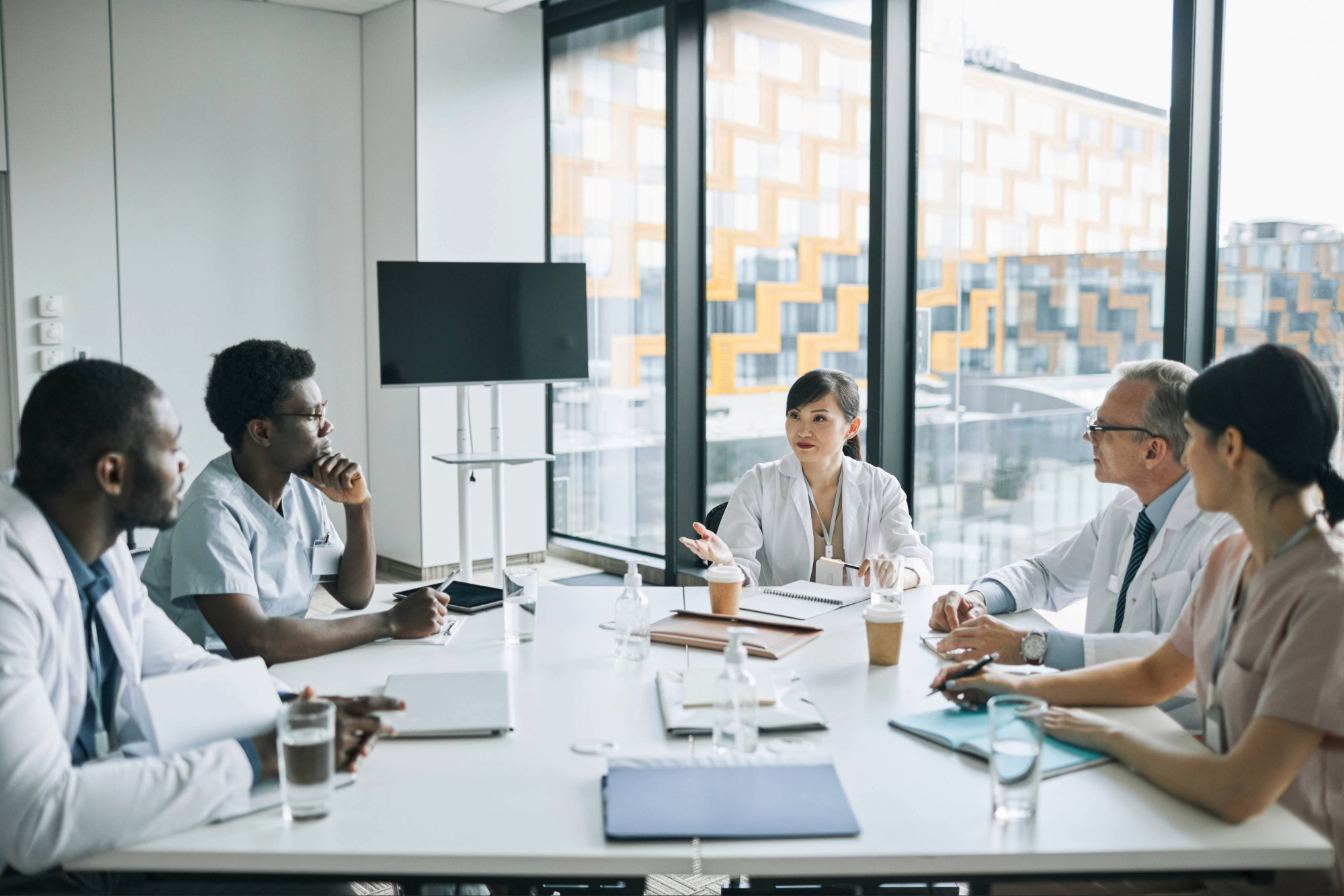 Group of medical professional discussion business around a table